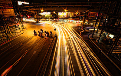 High angle view of light trails on road at night