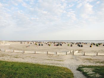 Beach chairs against sky