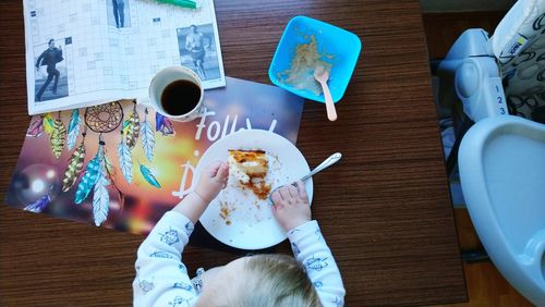 High angle view of woman having food