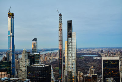 Modern buildings in city against sky