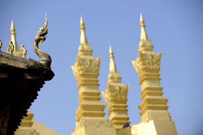 Statue of temple against building