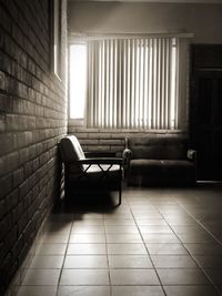 Empty chair against wall at home