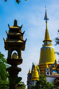 Low angle view of temple against blue sky