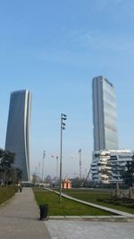 Modern city against clear sky