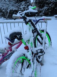 Close-up of snow on bicycle during winter