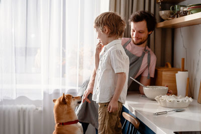 Friends enjoying at window