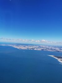 Scenic view of sea against blue sky