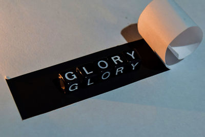 High angle view of information sign on table