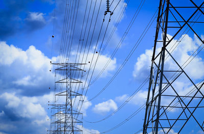 Low angle view of electricity pylon against sky