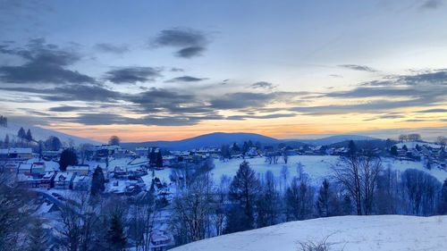 Panoramic view of townscape against sky during winter