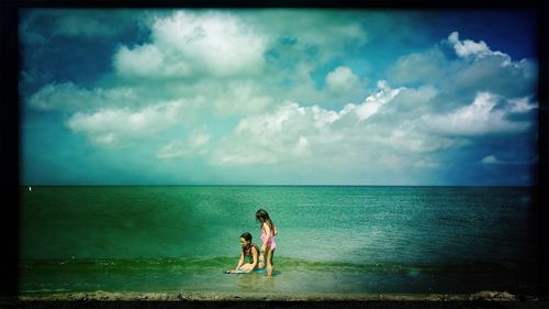 Scenic view of sea against cloudy sky