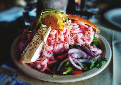 Close-up of chopped fruits in plate on table