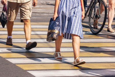 Low section of people crossing road