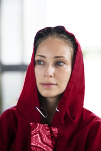 Portrait of young woman wearing hat