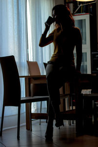 Woman drinking tea at home