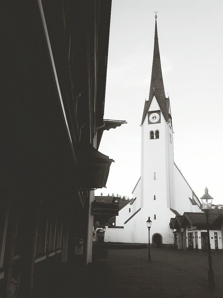 architecture, built structure, building exterior, low angle view, religion, church, place of worship, spirituality, clear sky, sky, outdoors, clock tower, guidance, day, no people, cross, clock, tower