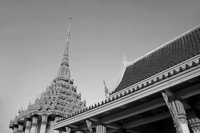 Roof and spire of wat khao di salak buddhist temple in suphanburi province, thailand in monochrome