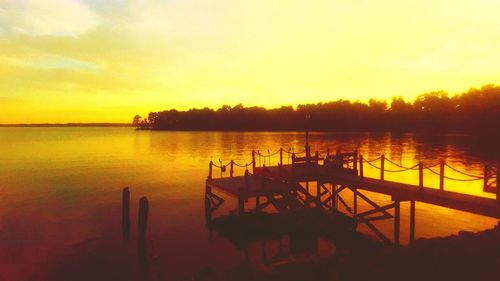 Silhouette of pier at sunset