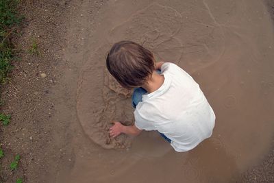 High angle view of boy on beach