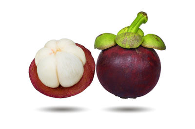 Close-up of fruits against white background