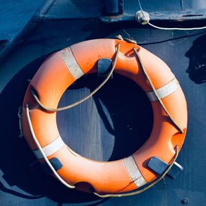 Orange lifebuoy on the boat