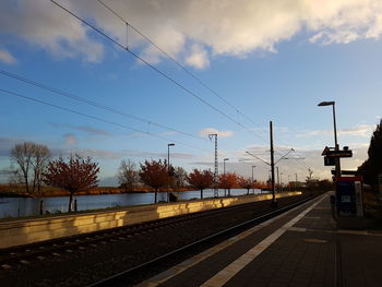 Railway tracks against sky at railroad station