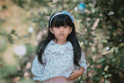 Portrait of a girl standing outdoors