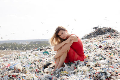 Portrait of young woman sitting on beach