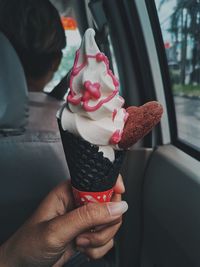 Midsection of person holding ice cream