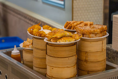 Delicious fried dumpling and wonton on dimsum bamboo steamer boxes