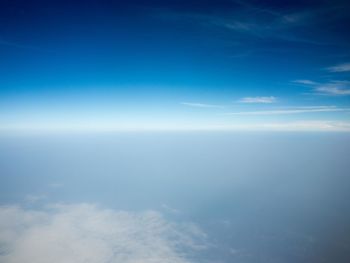Scenic view of sea against blue sky