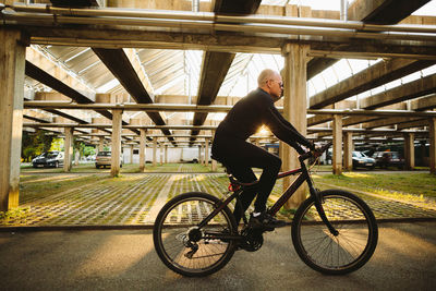 Full length of man riding bicycle