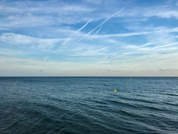 Scenic view of sea against blue sky