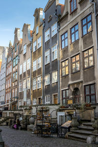 Buildings by street in city