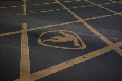 High angle view of arrow sign on road