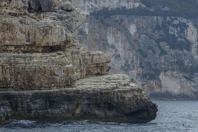 A massive rock that resembles a giant ship from the islands of the ionian sea