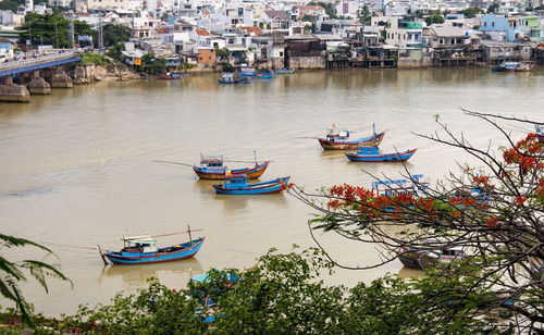 Boats moored in city