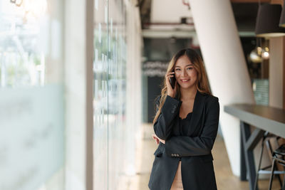 Young woman using mobile phone