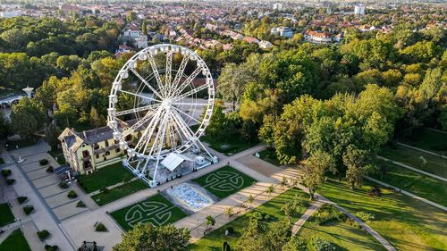 High angle view of ferris wheel in city