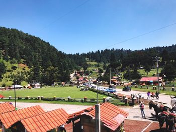 High angle view of people in park against clear sky