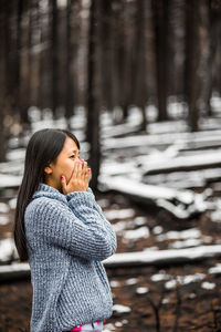 Portrait of a smiling woman in snow