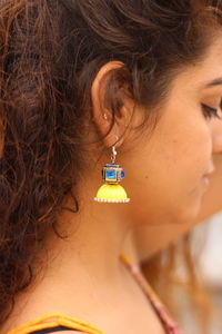 Close-up of woman with eyes closed standing outdoors