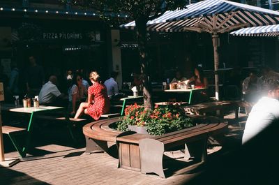 People in restaurant at market