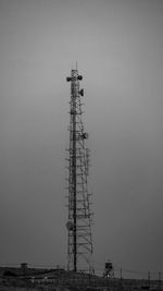 Low angle view of communications tower against sky