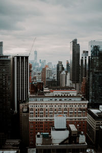 Modern buildings in city against sky