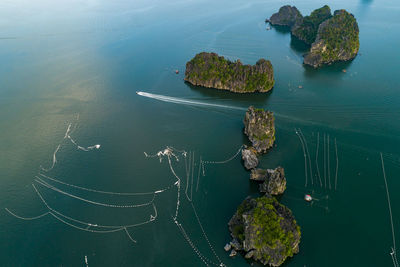 High angle view of rocks by sea