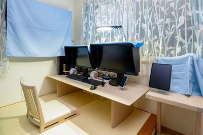 High angle view of woman using laptop on table