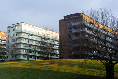 Buildings in city against clear sky