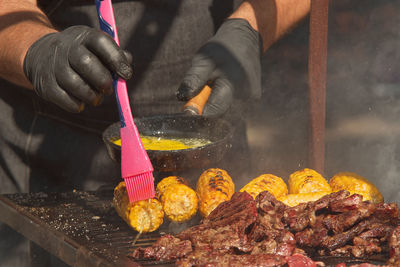 Midsection of man preparing food