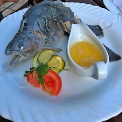 High angle view of fish in plate on table